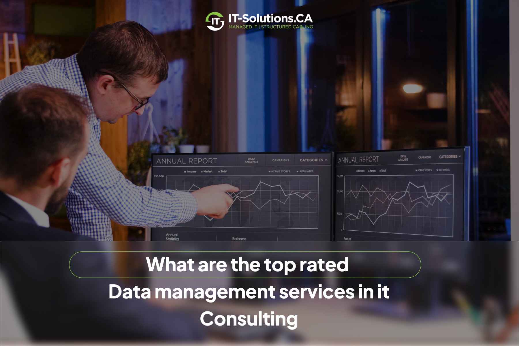 IT consultants analyzing line graphs on dual monitors, showcasing top-rated data management services.
