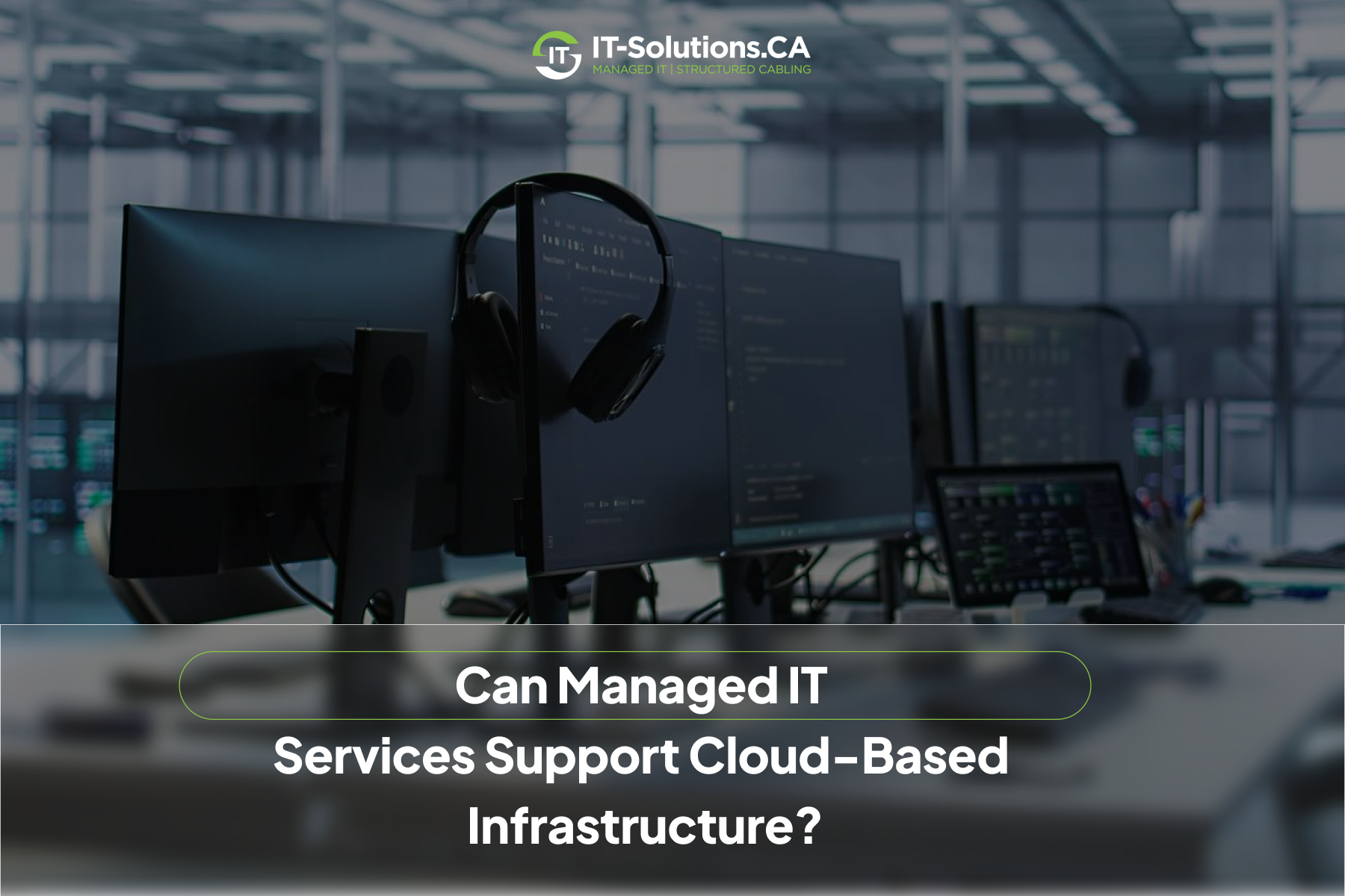 Darkened view of a modern workstation with multiple monitors and a headset, highlighting managed IT infrastructure support.